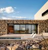 When the massive west-facing multi-slide door is open, cool Texas breezes course through the home's main volume. Photo 6 of West Texas Vistas modern home