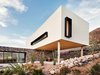 The white stucco volume stands out amid the rocky terrain of the Franklin Mountains near El Paso. Photo 3 of West Texas Vistas modern home