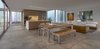 Modern home with Metal, Sliding Door Type, Dining Room, Bench, Table, Ceiling Lighting, and Porcelain Tile Floor. Huge panels of glass give the clients the ability to see into any number of the home’s courtyards at once. Photo 5 of Custom Cat House