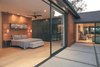 One of two massive pocketing Series 600 Multi-Slide Door in the master suite increase the residents' living space. Photo 2 of A Perfect Match modern home