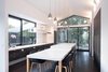 Modern home with Windows. The kitchen benefits from a multi-slide door and a large operable window that let fresh Santa Barbara breezes course through the space. Photo of Serenity Now