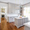 Modern home with Kitchen, Wood Cabinet, Engineered Quartz Counter, and Medium Hardwood Floor. Ceiling to floor windows give this spacious butler's pantry an open feel. Photo 3 of Spacious Tennessee Kitchen