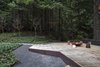 Modern home with Outdoor, Large Patio, Porch, Deck, Metal Patio, Porch, Deck, Hanging Lighting, Landscape Lighting, Trees, Garden, Wood Patio, Porch, Deck, Hardscapes, Gardens, Decking Patio, Porch, Deck, Shrubs, and Back Yard. Corten edge patio Photo 12 of Cypress Falls