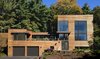 While the homeowners initially hoped to renovate and add on to their original home, a review of multiple renovation strategies revealed that it would be less expensive and less time-consuming to start from scratch and use a custom-designed prefab. Photo 9 of Custom Prefab House modern home