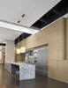 This Boston loft – nearly 5,000 SF with 18-foot high ceilings – presented a number of amazing opportunities and more than a few challenges. Chief among the opportunities was amplifying the immensity of the central living space – perhaps the largest in the city – while making an understandable and livable family house. Photo 7 of Urban Living XXL modern home