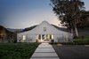 Modern home with Exterior, Farmhouse Building Type, House Building Type, and Wood Siding Material. #TurnbullGriffinHaesloop #barn #outdoor #exterior#landscape Photo of Hupomone Ranch