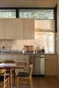 The architecture of Hood Cliff Retreat defers to the landscape, as evidenced by the cedar planks incorporated into several rooms of the home. Wittman Estes Architecture repurposed beams and siding from the original cabin as countertops and interior cladding. The firm's focus on simple details and a restrained material palette kept the construction budget to a minimum. Photo 16 of Hood Cliff Retreat modern home