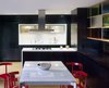 Kitchen and dining room with custom aluminized/ebonized oak casework Photo of Home for a Professor modern home