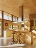 Modern home with Kitchen, Range Hood, and Wood Cabinet. Caterpillar House Photo 2 of Caterpillar House
