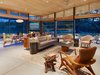 Modern home with Living Room, Chair, Sofa, and Pendant Lighting. Caterpillar House Photo 6 of Caterpillar House