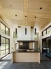 Modern home with Kitchen, Pendant Lighting, Range, Wood Cabinet, Wood Backsplashe, Concrete Floor, and Undermount Sink. Warm wood and dark surfaces contrast with white walls. Photo 5 of Sonoma Wine Country I