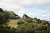 Modern home with Exterior, Wood Siding Material, House Building Type, Shed RoofLine, and Green Roof Material. House Ocho Photo 2 of House Ocho