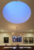 A view of the drum skylight at dusk. Early in the design process we discussed with our clients the work of James Turrell including a field trip to Meeting at MoMA PS1 on a very cold but wonderfully quiet day. One of the things we really like about Mr. Turrell's work is the flattening of perspective while creating a meditative balance between lightness and weight. Here the drum skylight while physically large recedes into the ceiling plan Photo 9 of White Street Residence modern home