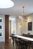 A view looking toward the children's playroom with a built-in window seat. The stair to the penthouse addition can be seen on the left, the drum skylight in the ceiling above. Photo 18 of White Street Residence modern home