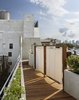Walking back down the ramp toward the penthouse in the late afternoon sun. Photo 12 of East Village Roof Garden modern home