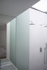 A glazed roof over the shower in the ensuite master bathroom provides framed views of the sky and rain. Photo 3 of Unité de Rénovation modern home