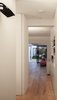 From the entry one gets elongated views toward the back of the scheme but the full extent of the space is elusive, with glimpsed views into spaces beyond, both laterally and longitudinally. Photo 9 of Unité de Rénovation modern home