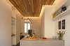Fluorescent lighting hanging over the plinth-like counter and concealed behind the lowered ceiling. Photo 13 of Object Space (Phase Four Espresso) modern home