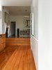 Variously finished in brick and timber, the scheme incorporates three interior levels and two exterior levels, heightening the sense of the landscape extending inside the building and vice versa. Photo 5 of Villa Leichhardt modern home