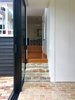 Variously finished in brick and timber, the scheme incorporates three interior levels and two exterior levels, heightening the sense of the landscape extending inside the building and vice versa. Photo 4 of Villa Leichhardt modern home
