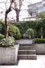 Modern home with Outdoor, Back Yard, Trees, Flowers, Raised Planters, Gardens, Hardscapes, and Concrete Patio, Porch, Deck. The raw concrete finish to the courtyard references the materiality of the brutalist architecture to the adjoining site. Photo 7 of Soupçon Brut