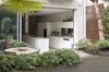 Modern home with Outdoor, Back Yard, Trees, Hardscapes, Raised Planters, Concrete Patio, Porch, Deck, Gardens, and Horizontal Fences, Wall. The modern intervention is articulated as a clean cut into the original building fabric, into which a sleeve of modern architecture is inserted. Photo 6 of Soupçon Brut