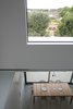 Modern home with Dining Room and Table. The double-height space encourages social interaction between the ground-floor living space and the lower-ground floor dining space. Photo 4 of Vertical Intersect