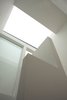 Modern home with Staircase. The second floor hallway is naturally lit—directly by a frameless roof-light, and indirectly by a wall of sand-blasted glass to the top floor bedroom Photo 8 of Vertical Intersect