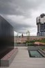 Modern home with Exterior, Metal Roof Material, Apartment Building Type, Flat RoofLine, and Metal Siding Material. The new-build pavilion is clad in black panels, black-backed glass, and black warehouse-style windows. Photo of Gallery Loft