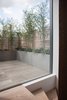 Modern home with Outdoor, Raised Planters, Horizontal Fences, Wall, Wood Fences, Wall, Decking Patio, Porch, Deck, Rooftop, and Wood Patio, Porch, Deck. While finished in timber rather than aluminum, the staircase that connects the two floors of the project is reminiscent of Donald Judd’s arrayed Stack installations. Photo 6 of Gallery Loft