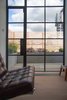Modern home with Doors, Swing Door Type, Exterior, and Metal. The top-floor pavilion accommodates a bedroom, living space and a bathroom inside a timber-clad volume. Photo 3 of Gallery Loft