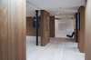 Modern home with Hallway and Light Hardwood Floor. The indoor and outdoor spaces on the top floor are articulated as a single open-plan space like the lower level—the detailing of the openings in the pavilion dissolving the threshold between inside and outside. Photo 9 of Gallery Loft