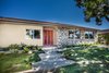 Modern home with Exterior, House Building Type, Shingles Roof Material, Stone Siding Material, and Stucco Siding Material. welcome home Photo 2 of - : - MidCentury Ranch in Dover Shores - : - for sale : 4 bed | 3 bath | 2032 sq' | large lot with a pool