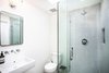 Modern home with Bath Room, Concrete Floor, Ceramic Tile Wall, Two Piece Toilet, Pedestal Sink, and Enclosed Shower. got a "penny" Photo 13 of - : - MidCentury Ranch in Dover Shores - : - for sale : 4 bed | 3 bath | 2032 sq' | large lot with a pool