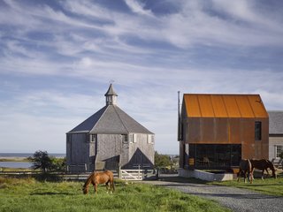 The gabled roof on Enough House puts it in conversation with the adjacent Troop barn and Cheboque schoolhouse, but its Cor-Ten steel exterior makes it a unique addition to Shobac.