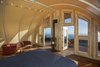 Modern home with Living Room, Coffee Tables, Chair, Gas Burning Fireplace, Dark Hardwood Floor, Track Lighting, and Rug Floor. The tent fabric guards against the torrential wind and rain that can sweep through Big Sur. Parr customized the entryway to maximize the view. Photo 2 of Treebones Resort