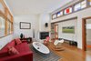 A white brick wall provides visual and material contrast to warm wood elements throughout the home. Photo of 47+ Midcentury Modern Homes Across America modern home