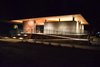 Modern home with Exterior, Concrete Siding Material, and Flat RoofLine. The Clubhouse holds the reception desk, spa-inspired bathrooms and showers, the Canteen, and lounge areas. During inclement weather, a curtain encloses the open pavilion like tent walls. Photo 2 of AutoCamp Russian River