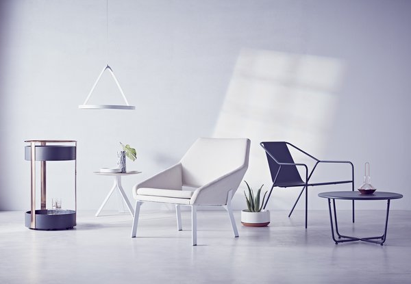 Modern by Dwell Magazine is a holistic home collection, available exclusively through Target starting December 27. Pictured above from left to right: the Bar Trolley in black/copper, $149.99; LED Pendant Light in white, $99.99; Side Table in white/natural, $89.99; Lounge Chair in white/natural, $249.99; Outdoor Lounge Chair in gray, $269.99 for two; Outdoor Side Table in gray, $89.99.