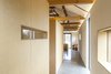 Modern home with Bedroom and Wardrobe. Simple plywood, cut out to allow views of the landscape, creates subdivisions within the home for private bedroom and bathroom spaces. Rather than formal rooms, they have the effect of large-scale furniture. Photo 9 of Church Hill Barn