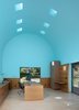 Modern home with Office, Chair, Desk, Light Hardwood Floor, and Storage. The office boasts an 18-foot, barrel-vaulted ceiling, an architectural metaphor for inspiration and exaltation. Photo of 17 Stellar Uses of Color in Home Offices
