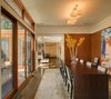 The formal dining room can open onto the terrace as well, while sliding pocket doors give the option of privacy and intimacy. Photo 6 of The Brown Residence modern home
