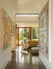 Mahogany windows and doors, black walnut floors, and beech veneer millwork create warmth in the bright interior. Photo 4 of The Brown Residence modern home