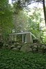 As you approach the home from below, it gives the impression of gradually emerging from the natural landscape. Photo 10 of The Booth House modern home