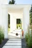 Modern home with Outdoor, Walkways, Front Yard, Pavers Patio, Porch, Deck, and Concrete Patio, Porch, Deck. An open-air entry pavilion contributes to a sense of arrival at the home. Photo 2 of 534 Twin Bridges Road