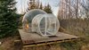 Modern home with Exterior, Tent Building Type, Dome RoofLine, and Cabin Building Type. Smaller bubbles come with a round bed that sleeps two, while the larger units have a double bed. Guests share a wood-clad outbuilding that holds the restroom, showers, and kitchen. Adventurers can also book the Golden Circle Tour through Buubble, exploring Thingvellir National Park, the Geysir hot springs, Gullfoss waterfall, and the Secret Lagoon before spending a night at the hotel. Photo of Buubble – The 5 Million Star Hotel