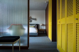 Deep yellows can open and warm up any space. PPG Pittsburgh Paints' Wright Mustard (FLLW321), and Glidden’s Wheat Stalk (30YY 52/515) are two paint colors that complement contemporary midcentury-inspired interiors. In this rare midcentury prefab, bright closet doors provide storage space and a healthy dose of color from various vantage points.