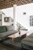 Modern home with Living Room, Concrete Floor, Rug Floor, Coffee Tables, and Sofa. Room 13 holds a gallery that showcases their own pieces alongside changing solo exhibitions (photographer Woody Gooch is on display until June 30), while Room 14 serves as the flagship store for NON-TYPE, a new lifestyle brand by George and his Ksubi collaborator Gareth Moody. Photo 4 of The Slow