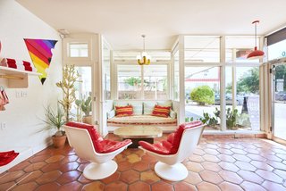 Reds are great for designers and homeowners who want to be courageous with color. In fact, Frank Lloyd Wright even claimed his own favorite shade, calling it "Cherokee Red." He used it throughout his residential projects, often covering whole floors with it. This rejuvenated Austin hotel celebrates midcentury design with pops of red scattered throughout.