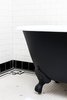 Modern home with Bath Room, Subway Tile Wall, Freestanding Tub, and Ceramic Tile Floor. Brass fixtures and soaking claw foot tubs in the bathrooms give a classic feel to the modern hotel experience. Photo 9 of Lokal Hotel